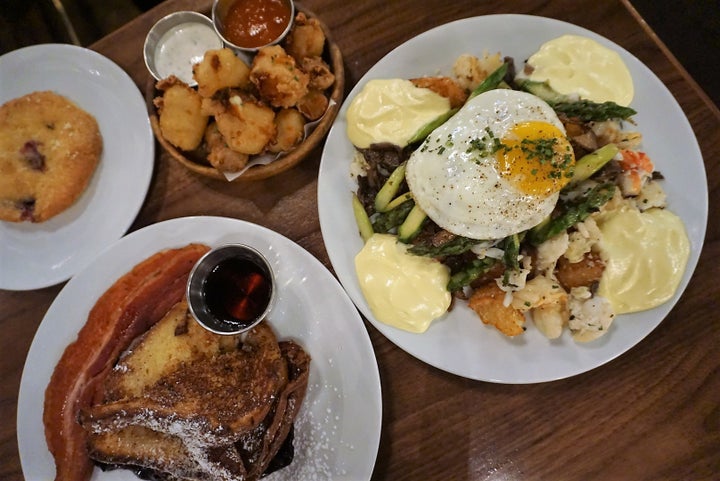 <p>Clockwise from top: Beer-battered cheese curds, King Crab hash ( king crab, shrimp, mushrooms, asparagus, crispy potatoes & hollandaise ), Brioche French Toast with house made bacon, Blueberry Muffin.</p>