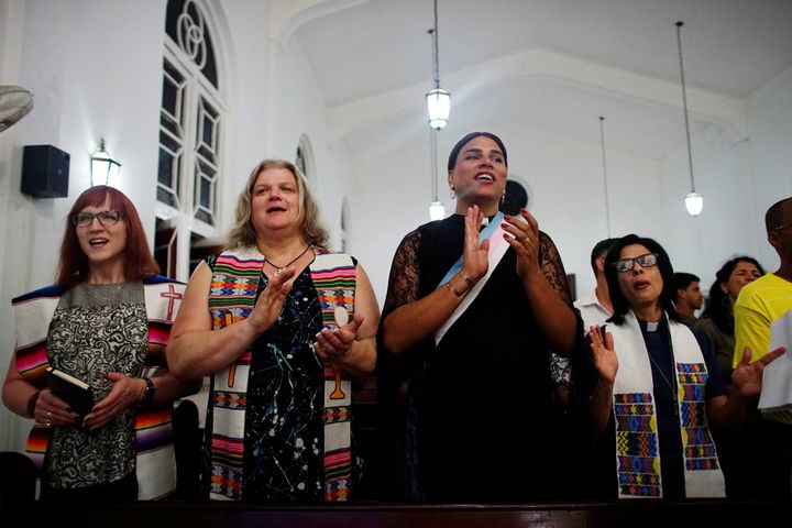 Trans Baptist reverend Allyson Robinson from the U.S., trans pastors Cindy Bourgeois from Canada and Alexya Salvador from Brazil, and lesbian pastor Elaine Saralegui sing during a mass in Matanzas, Cuba, May 5, 2017.