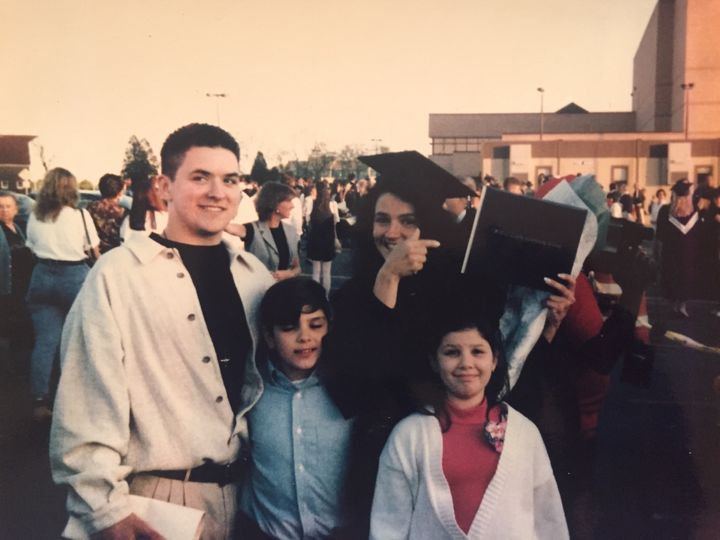 <p>Donna Martino at her college graduation with her three kids, Angelo Jaret and Brianne.</p>