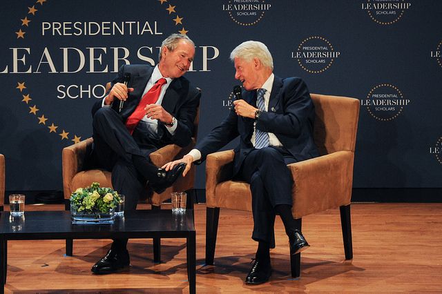 Former Presidents George W. Bush and Bill Clinton share a stage at the July 2015 graduation of the Presidential Leadership Scholars. 
