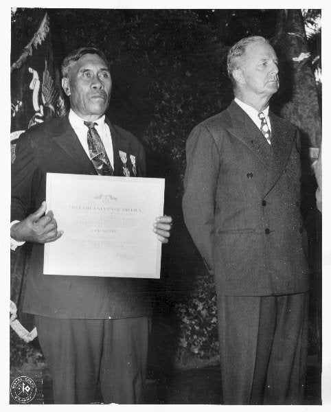 Benjamin Kanahele, of Niihau, Hawaii, displays the Medal for Merit and Purple Heart awarded to him for killing a Japanese pilot who landed on Niihau after the Dec. 7 attack on Pearl Harbor. The pilot shot Kanahele three times before Kanahele killed him.