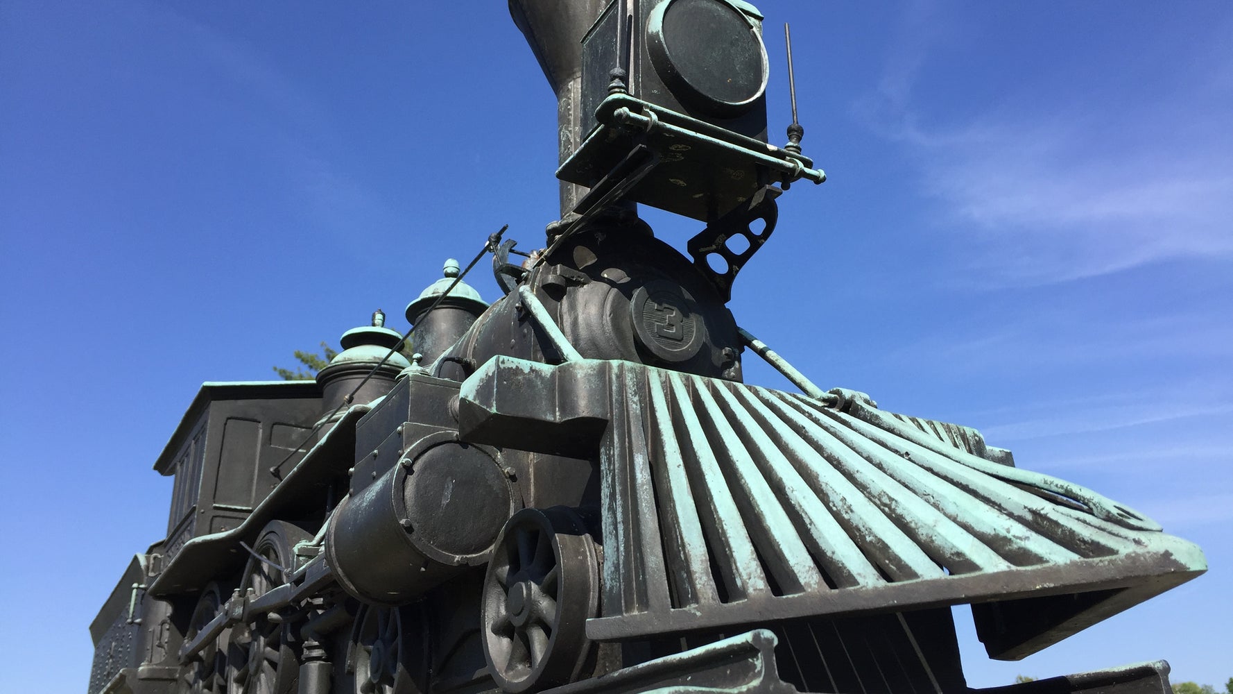 Young man looking out of train window on the historic steam engine