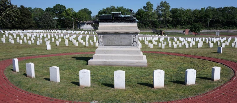 The eight executed raiders are buried in a semicircle around the monument.