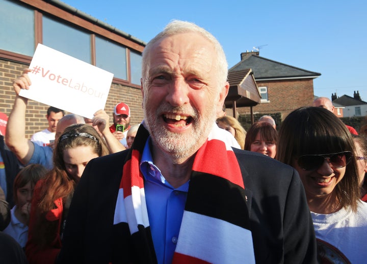 Labour leader Jeremy Corbyn wears a Rotherham United scarf after making a speech on the general election campaign trail in Rotherham.