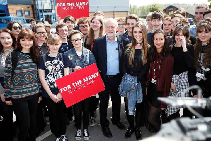 Jeremy Corbyn poses for a picture with first time voters at a campaign event in Garfoth, Leeds.