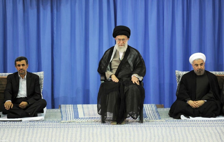<em>Iranian supreme leader Ayatollah Ali Khamenei (center) during a ceremony officially endorsing moderate cleric Hassan Rowh
