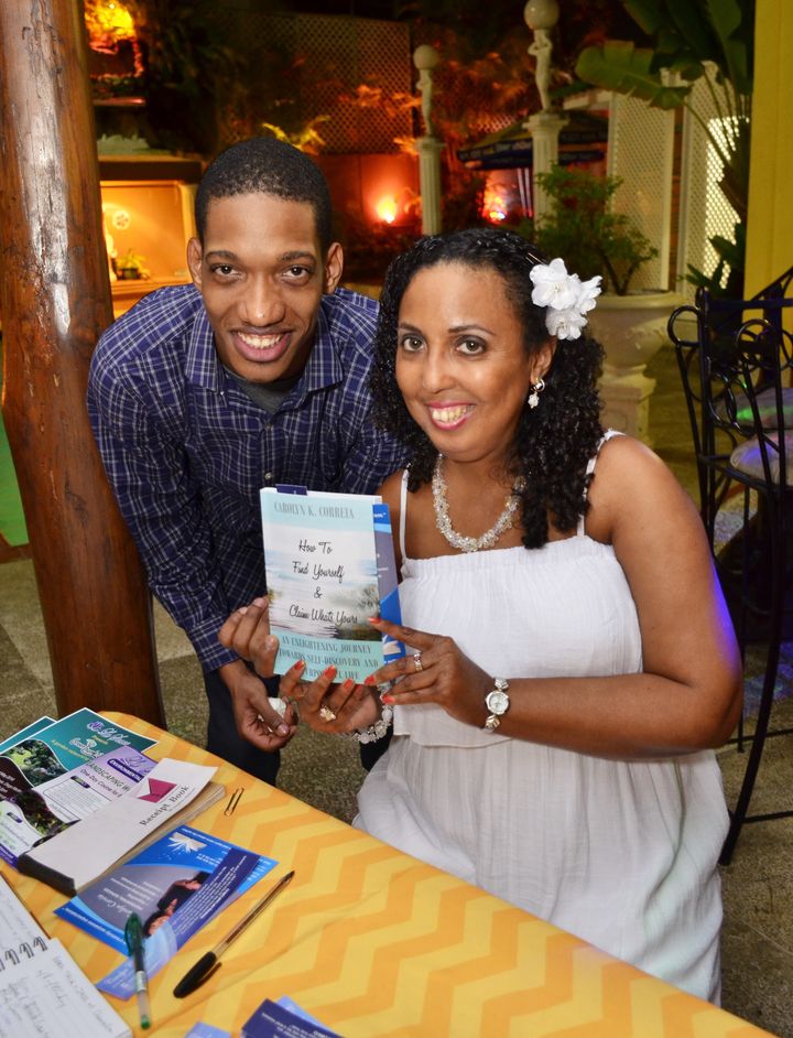 Signing a book for loyal customer Keegan St Martin at Book Talk & Jazz - April 2016 - The Chancellor Hotel, Trinidad and Tobago.