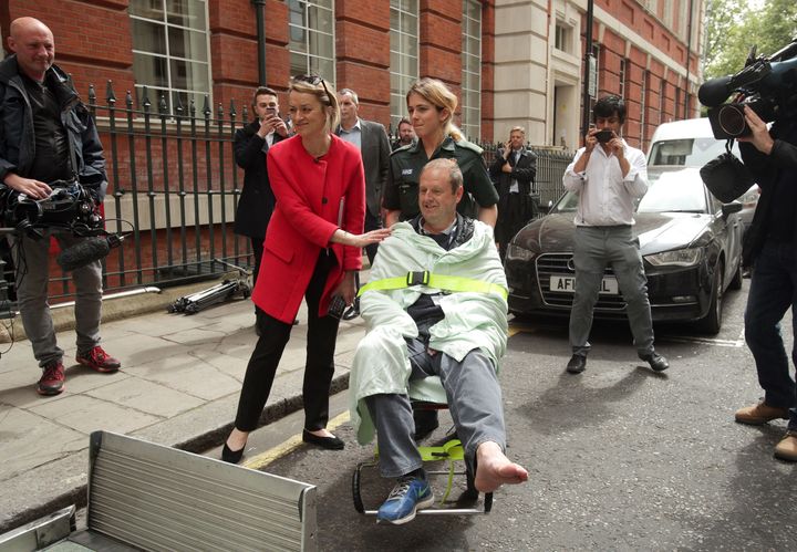 BBC Political Editor Laura Kuenssberg comforts her her colleague, BBC cameraman Giles Wooltorton after the incident