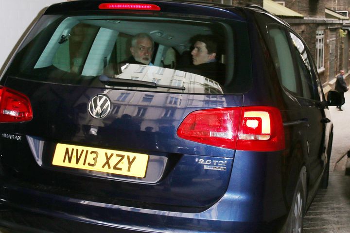 Jeremy Corbyn looks around as his car strikes BBC cameraman Giles Wooltorton as it made its way into a garage entrance