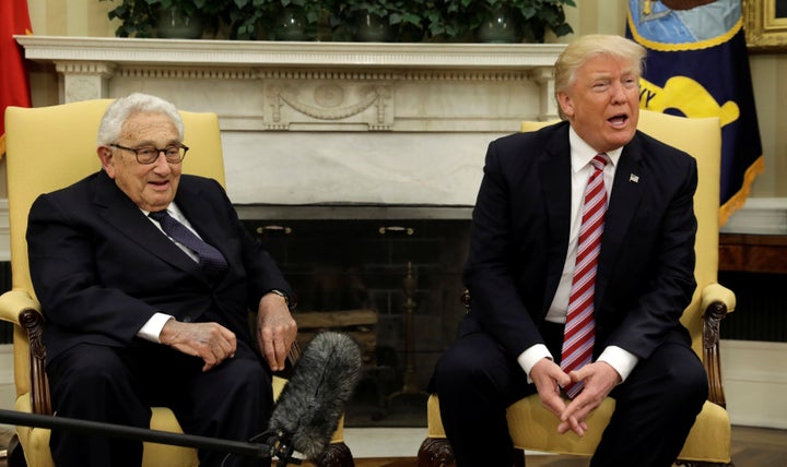 Kissinger and Trump chat with reporters yesterday.