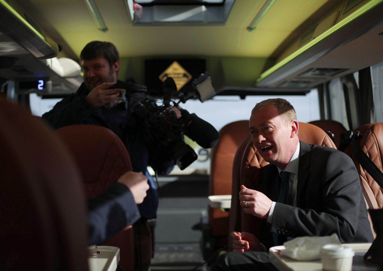Liberal Democrats leader Tim Farron speaks to reporters on his general election battle bus.