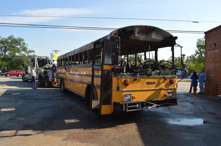 A school bus that caught fire while transporting children to school on Tuesday morning is seen.