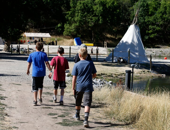 Boy Scouts walk around camp Maple Dell on July 31, 2015 outside Payson, Utah.