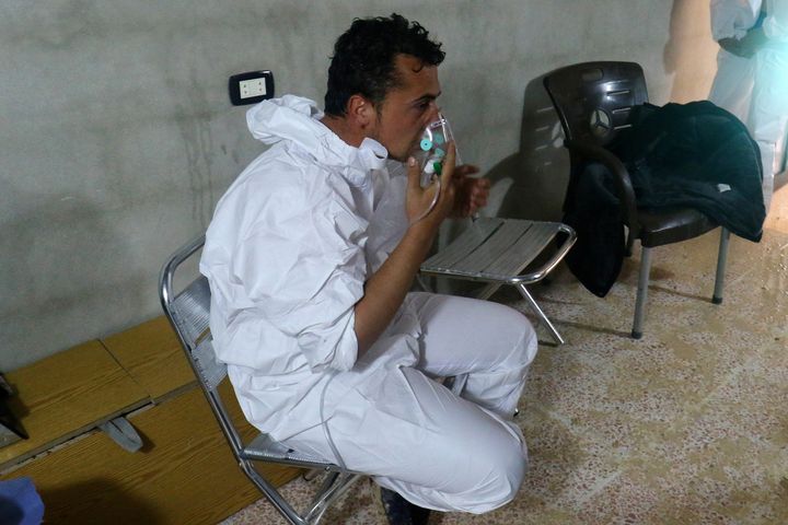 A man breathes through an oxygen mask, after what rescue workers described as a suspected gas attack in the town of Khan Sheikhoun in rebel-held Idlib, Syria.