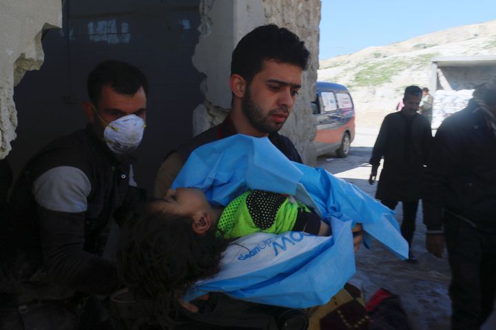 A man carries the body of a dead child, after what rescue workers described as a suspected gas attack in the town of Khan Sheikhoun in rebel-held Idlib, Syria April 4, 2017.
