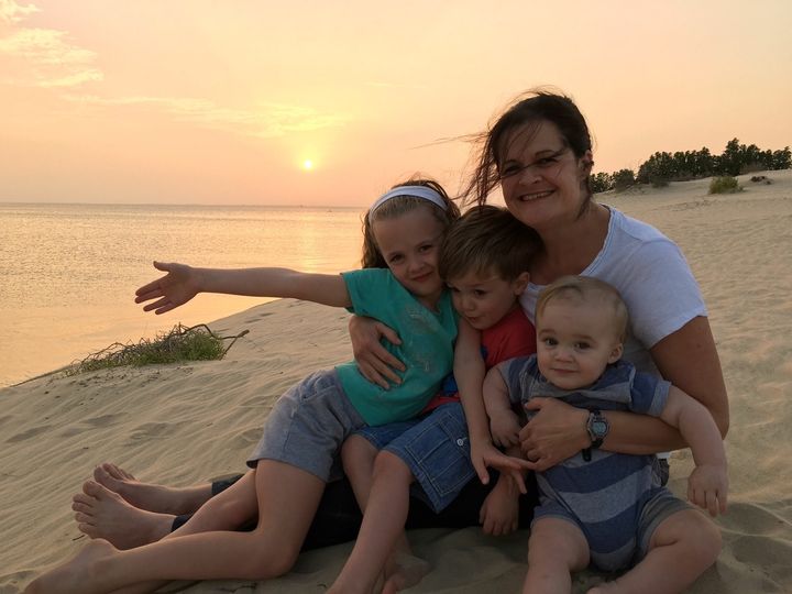 My wife with our three kids last year. 