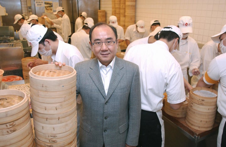 Yang Chi-hua, who has been running the restaurant chain since his father retired, stands among bamboo steamers.