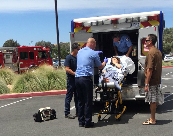 <p>Lori being loaded on the ambulance. A fire truck from Darren’s team also responded.</p>