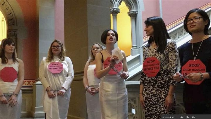 <p>Women in chains protest against child marriage at the New York Capitol in Albany. New York and other states are considering tightening laws that allow minors to marry with parental or judicial approval.</p>