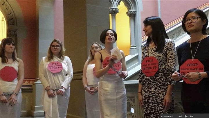 Women in chains protest against child marriage at the New York Capitol in Albany. New York and other states are considering t