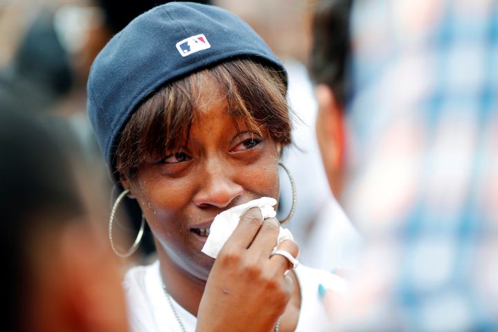 Diamond Reynolds, girlfriend of Philando Castile, weeps as people gather to protest the fatal shooting of Castile by Minneapolis area police during a traffic stop. 