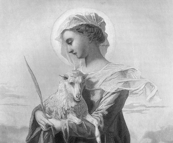 An engraved portrait of the maiden Saint Agnes (born circa 291), the patron saint of virgins, holding a lamb. She was martyred in 304 AD at the age of thirteen after being denounced as a Christian and repeatedly refusing marriage.