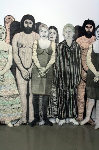 <p><em>Tribe</em> (detail), woodblock printed, dyed and quilted fabric, life size figures</p>
