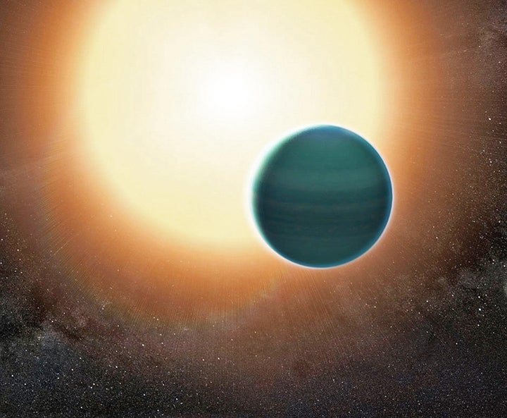 An illustration of the distant “warm Neptune” exoplanet, dubbed HAT-P-26b. The atmosphere appears to be composed of hydrogen and helium, along with water vapor.