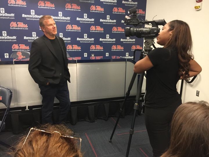 Tilman Fertitta, the Billion Dollar Buyer, is interviewed by an area news reporter before speaking at the University of Mississippi. 