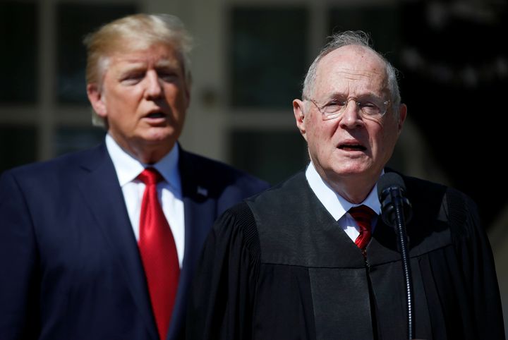 President Trump listens as Justice Anthony Kennedy speaks.