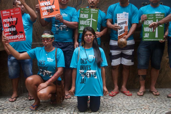 Indigenous peoples, fishermen and representatives of social movements protest outside the headquarters of the National Agency for Oil and Gas, in Rio de Janeiro.
