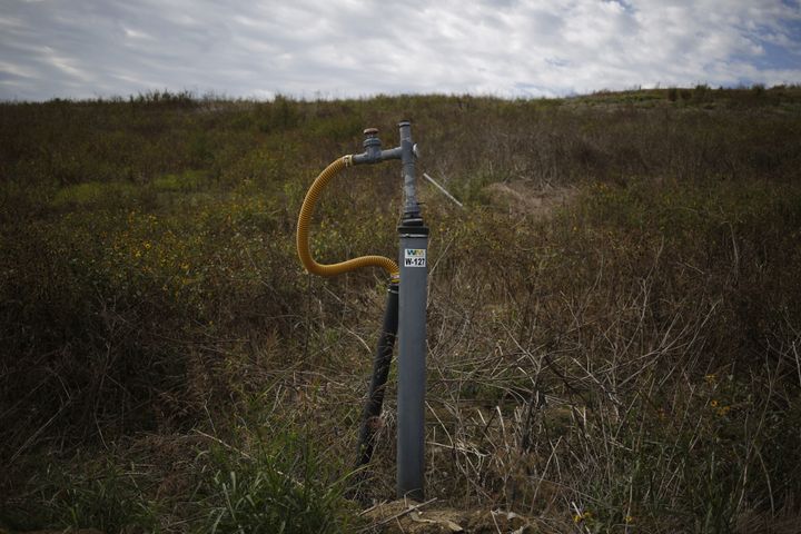 A methane gas well sticks out from the ground at the Waste Management Inc. Skyline Landfill in Ferris, Texas, U.S., on Monday, Oct. 24, 2016.