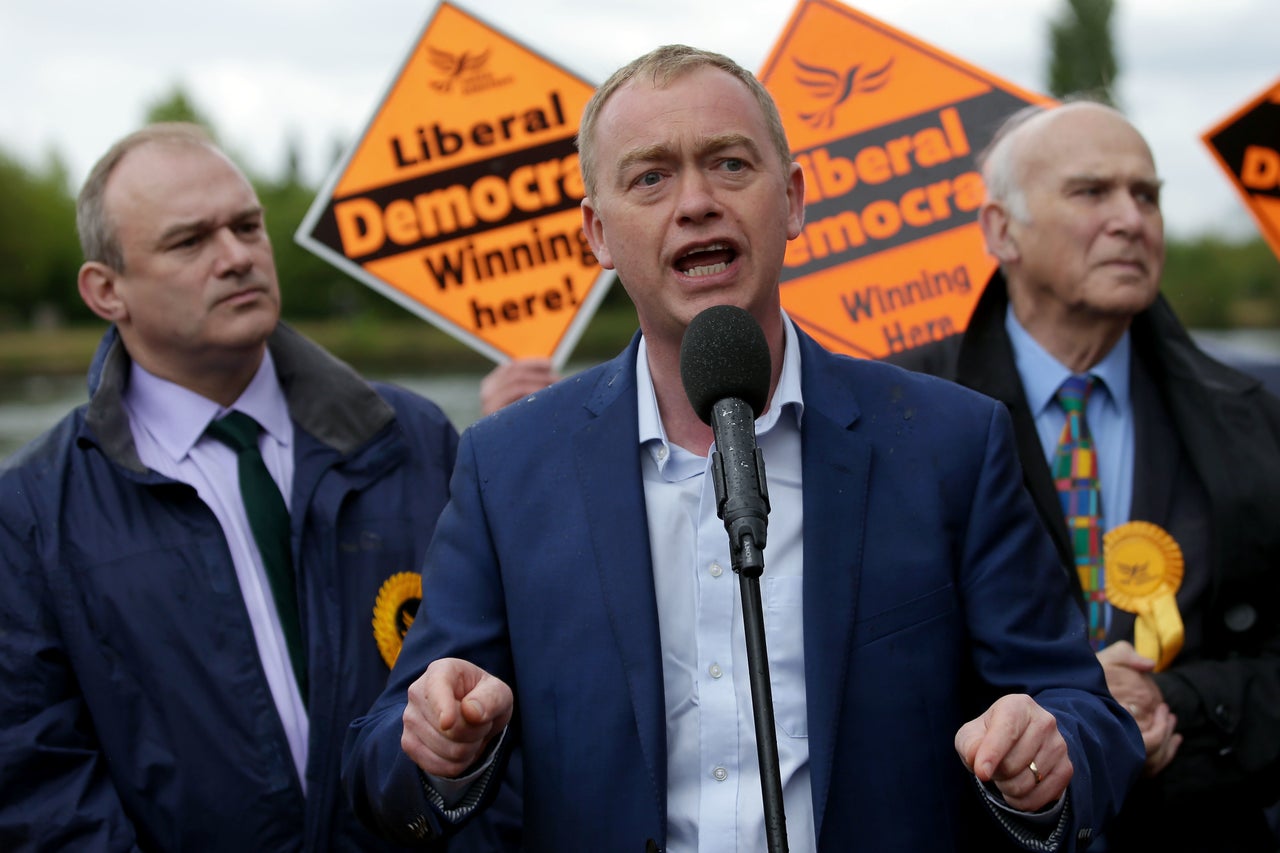 Lib Dem leader Tim Farron (C) speaks alongside former Lib Dem MPs Ed Davey (R) and Vince Cable.