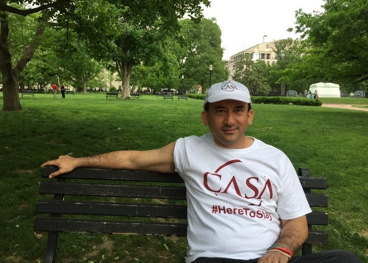 <p><em>Javier Luna, CASA community organizer, sits on a park bench outside The White House after May Day march protests. Photo by Aya Elamroussi</em></p>