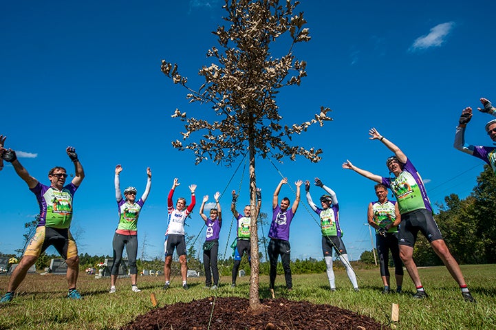 Participants in the 2016 STIHL Tour des Trees at one of many tree plantings during their ride through the Carolinas.