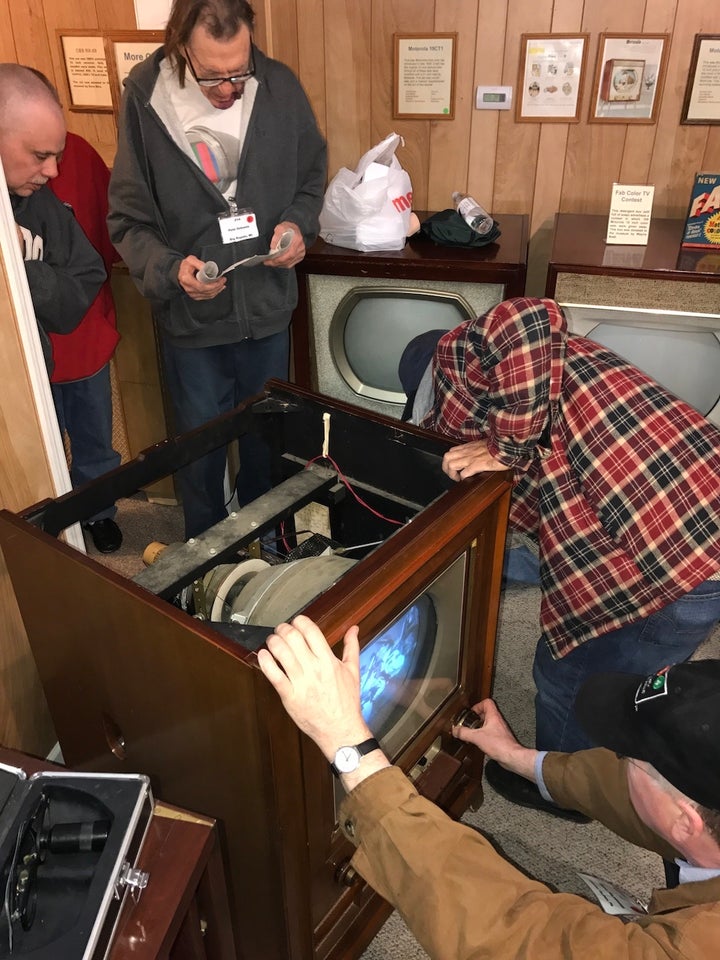 Early TV Museum members repairing a 1954 RCA color TV 