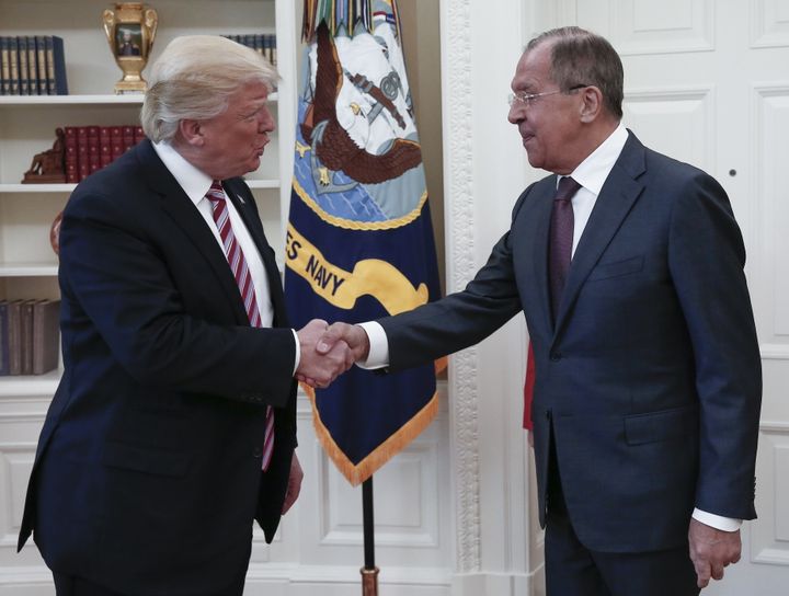 President Donald Trump shakes hands with Russian Foreign Minister Sergei Lavrov as they meet for talks in the Oval Office at the White House.
