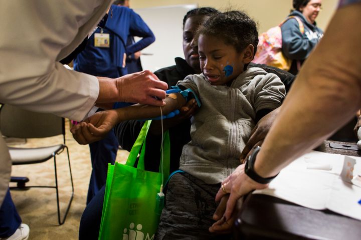 A 6-year-old boy in Flint, Michigan, has blood drawn to test his blood lead levels on Feb. 4, 2016.