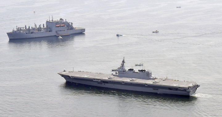  Japan’s helicopter carrier Izumo (right) recently escorted a US supply ship along the country’s Pacific coast. 