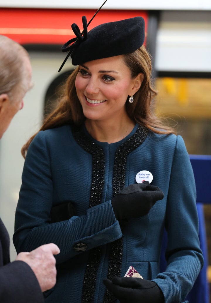 The Duchess of Cambridge wore a "Baby on Board" badge during a Tube station visit to mark the 150th anniversary of the London Underground in 2013.