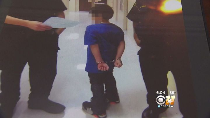 The 7 year olds mother says this photo was taken after police put the boy in handcuffs.