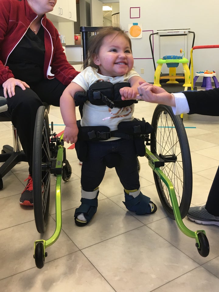 <p>Ellis in her Kid-Walker at a Therapy Session</p>