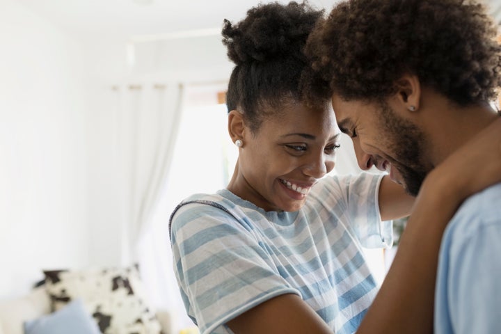 Affectionate couple hugging face to face Hero Images via Getty Images