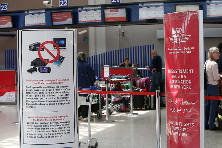 <p> Placards at Casablanca Mohammed V International Airport inform passengers that laptops and other electronic devices must be checked on flights to the U.S. and the U.K.</p>