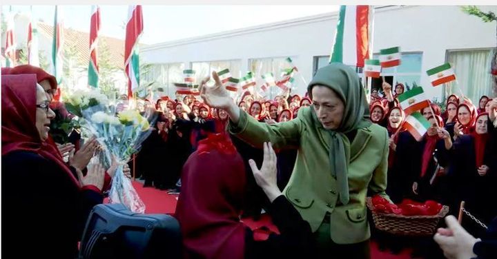 <p>Maryam Rajavi and her flag waving slaves in Tirana, Albania</p>