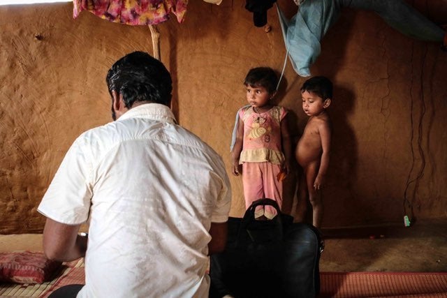 As Nur Kabir tends to Sona, who recently suffered a miscarriage, her children look on. With efforts to thoroughly investigate