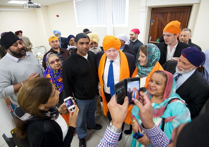 Johnson wore an orange turban during his visit to the temple in Bristol on Wednesday