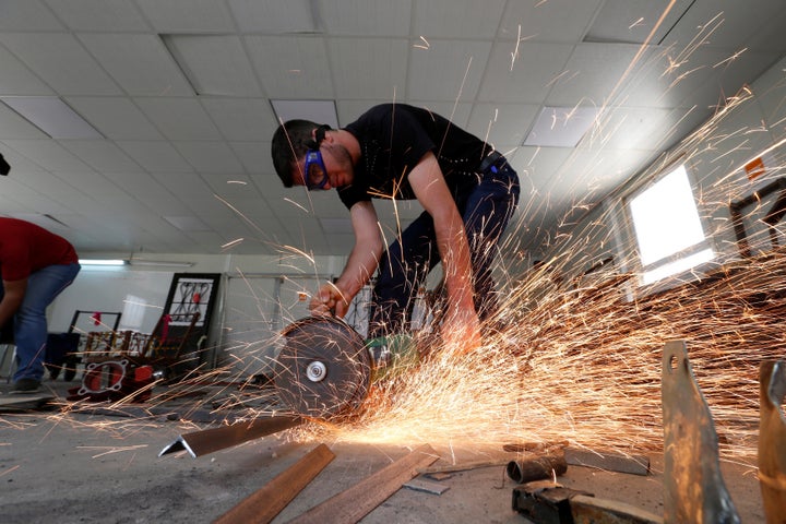 Syrian refugee metal shop trainees work at one of the vocational training centers in the Azraq camp, June 27, 2016.