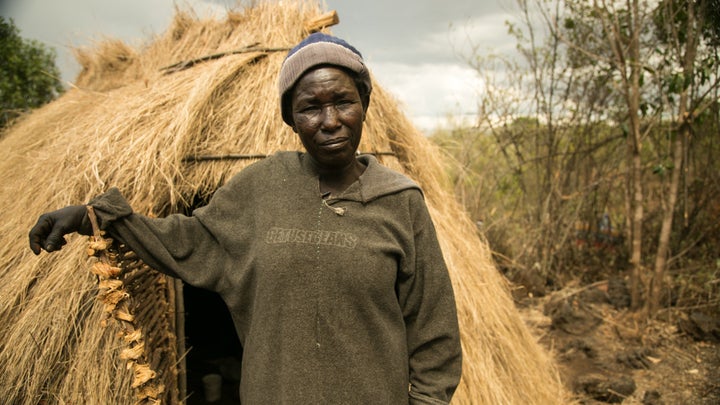 Hellen Ruttoh Tarko lived in a cave for more than a decade. Her new home is made of grass and sticks.