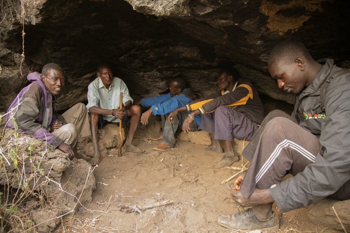 Friends gather in a cave in Kenya's Great Rift Valley. People who live here are at greater risk of contracting cutaneous leishmaniasis because the sand flies that spread the disease tend to swarm in cool, rocky areas.